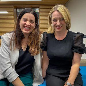 Kate Bowler and Christie Watson, sitting side by side and smiling